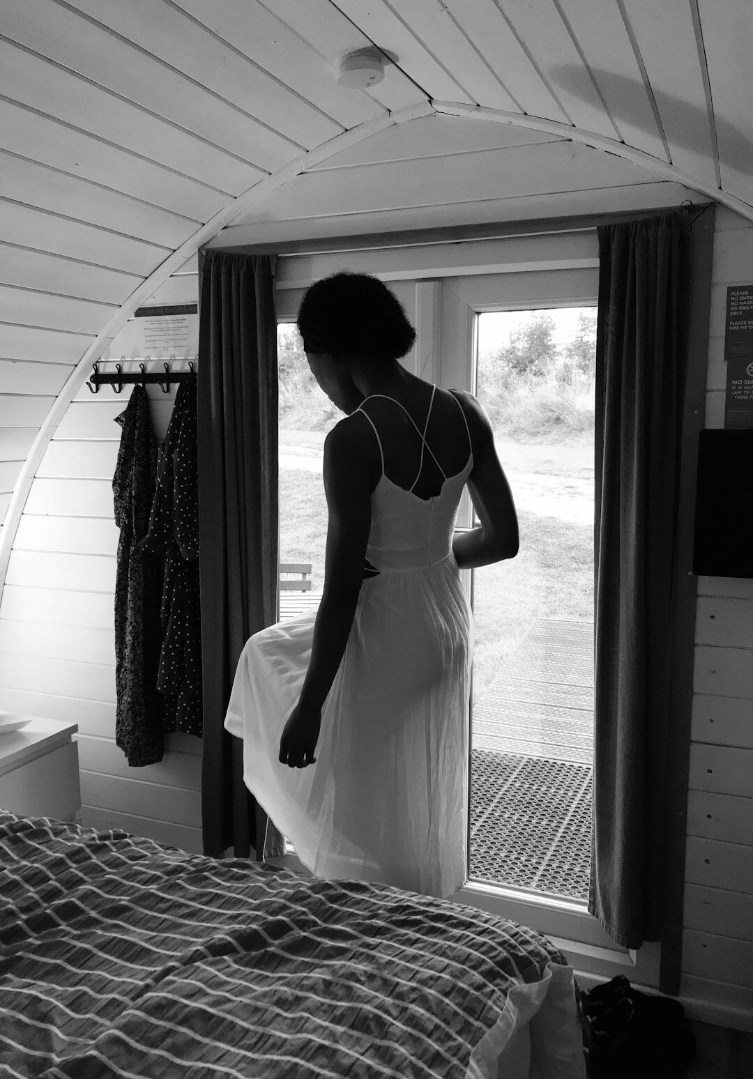 woman making bed in morning