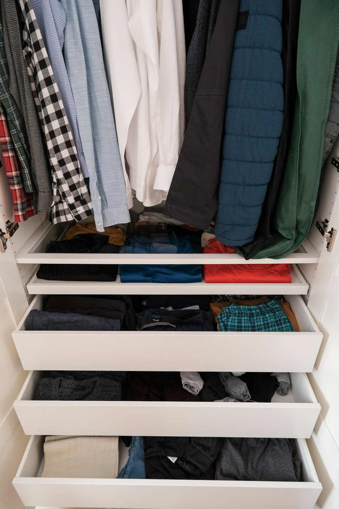 folded clothes in closet