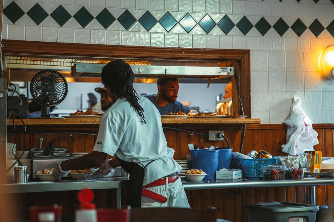 woman wiping kitchen counter